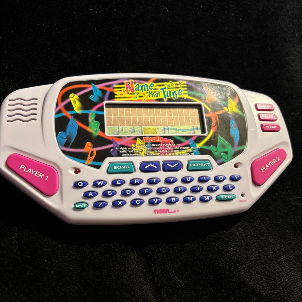 Name That Tune White Handheld Game by Tiger Toys . 1997